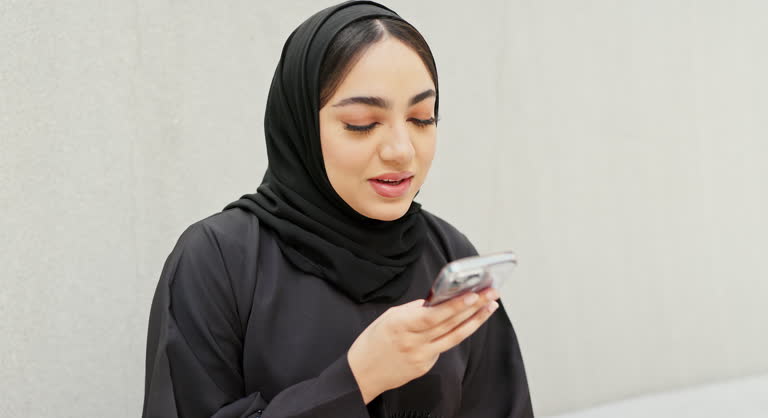 Young Saudi woman communicating on video call