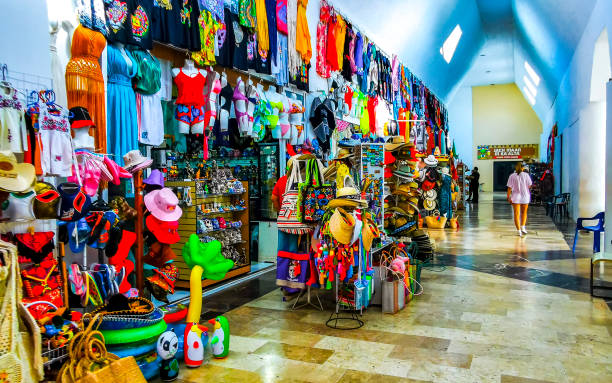 Tulum Quintana Roo Mexico 25. October 2023 Typical colorful street and cityscape with palm trees tourism shops bars and restaurants of Tulum in Mexico.