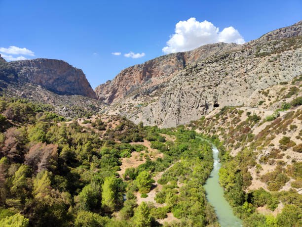 Landscape view with the Guadalhorce river at El Caminito del Rey (The King's Little Path) a 7.7 kilometres long walkway pinned along the steep walls of a narrow gorge in El Chorro, near Ardales in the province of Málaga, Spain.
