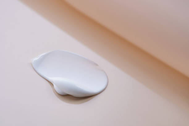 istock The texture of cosmetic cream on a beige background. 2197387214
