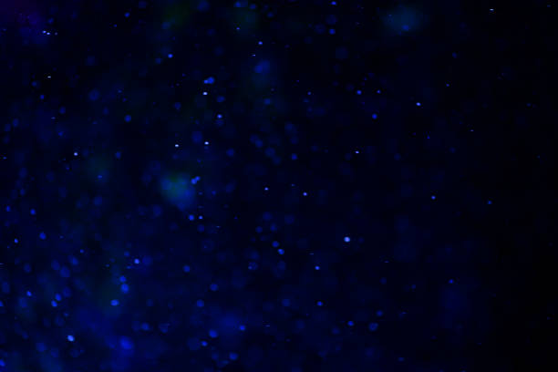 istock Blue glitter bokeh sparkles lights dark abstract overlay background 2197387240