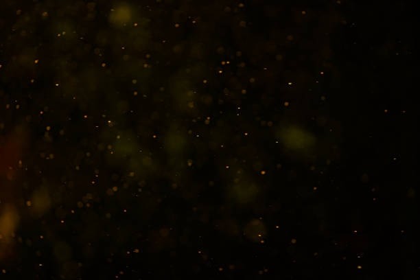 istock Yellow orange glitter bokeh sparkles lights dark abstract overlay background 2197387242