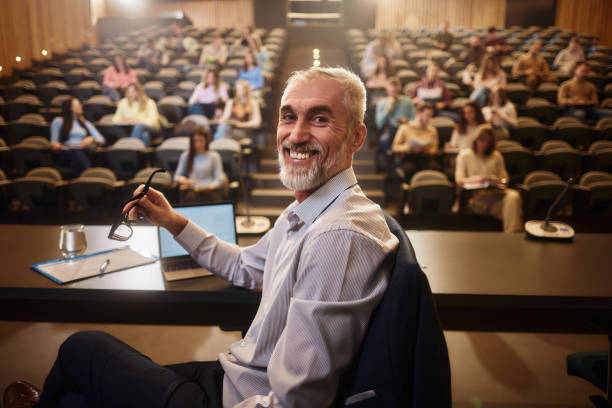 istock Happy mature professor on a class at lecture hall. 2197387337
