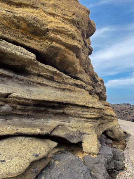 istock Eroded sedimentary rock layers in U-do, Jeju Island 2197391451