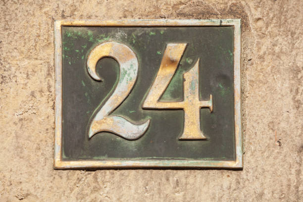 istock House license plate number 24 on brown house wall, Germany 2197394185