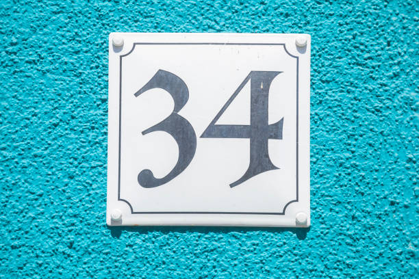 istock House license plate number 34 on blue background, Germany 2197394587