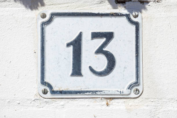 istock White house number sign number 13 on white background, superstition, Germany 2197394601