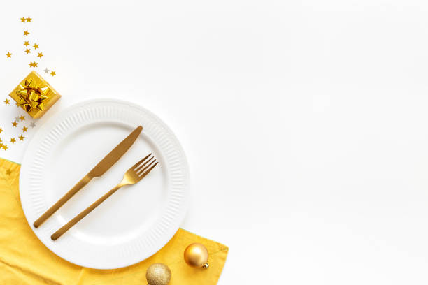 istock Christmas and New Year Eve table setting flatlay. Empty plate with cutlery and decoration, top view 2197394702