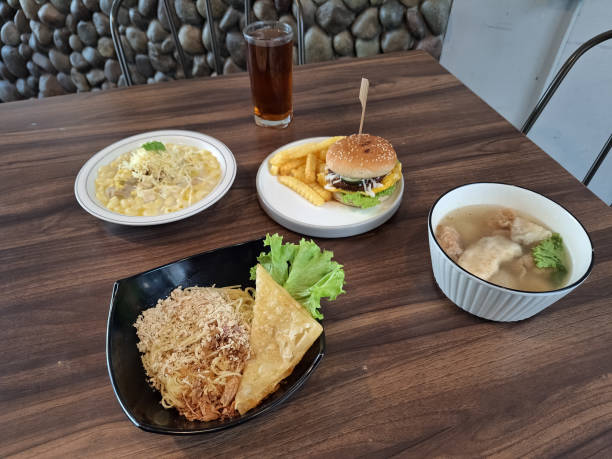 istock Tasty Mi Goreng Pangsit Or Fried Noodle With Fried Dumpling, Stoop Macaroni Or Macaroni Soup, Beef Burger Fries, Bakso Cuanki Or Meatball Soup. Fresh Tea In Glass. Food And Drink Menu. 2197394796