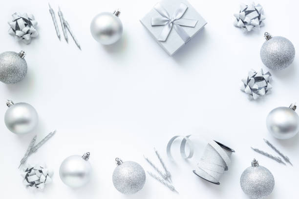 istock Silver colored Christmas and New Year decorations on white background, top view 2197395749