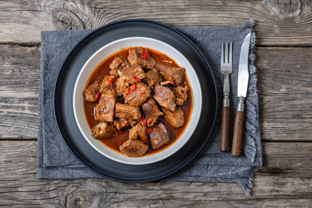 istock beef stew in a white bowl on rustic wooden table 2197396198