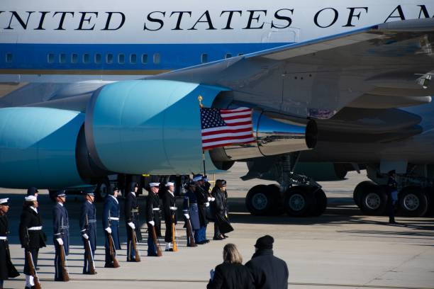 Andrews AFB, United States – January 10, 2025: The American flag waves by Air Force One at Jimmy Carter's state funeral