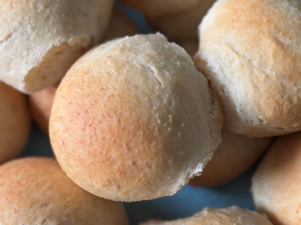 istock Image of mini dough portions, freshly baked  soft rolls and buns, golden crust light texture, close-up of homemade bakery items 2197402575