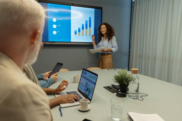 istock Engaged audience listens to meeting presentation data. 2197402710