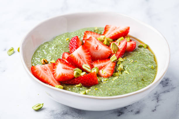 istock Green matcha chia pudding with strawberries and pistachios. 2197403418