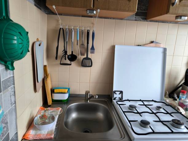 istock Kitchen utensils on the wall in the kitchen. 2197403550