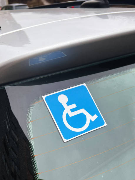 istock Blue Handicap Sign Displayed on Rear Window of a Parked Vehicle 2197404253
