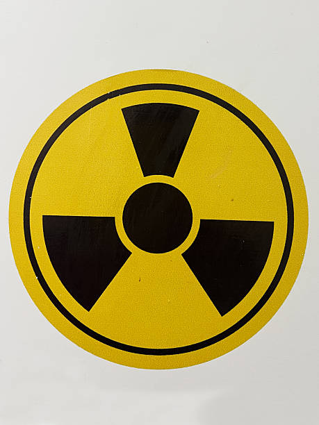 istock Yellow and Black Radiation Hazard Symbol on White Background 2197404289