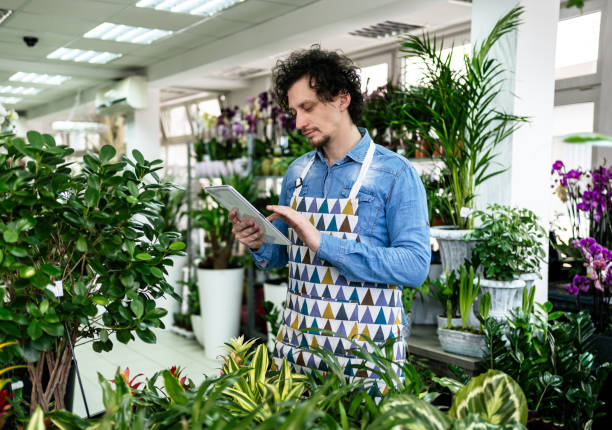 istock Florist using digital tablet in a flower shop 2197408465