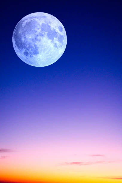 istock Majestic Full Moonrise. yellow, purple and blue sky. dramatic sunset 2197415121