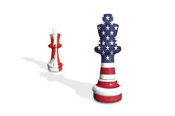 istock Chess made from US and Canada flags on a white background with word TRADE WAR 2197420528