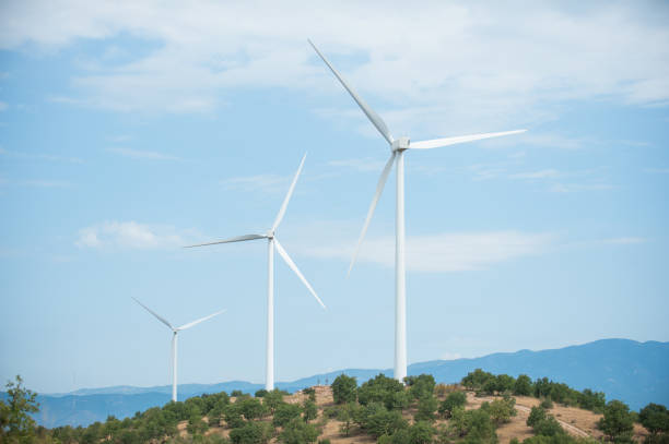 istock Wind Turbines Standing Tall Against Blue Sky 2197422234