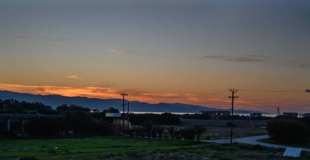 istock Vibrant sunset illuminates tranquil landscape overlooking distant mountains and calm waters 2197422297