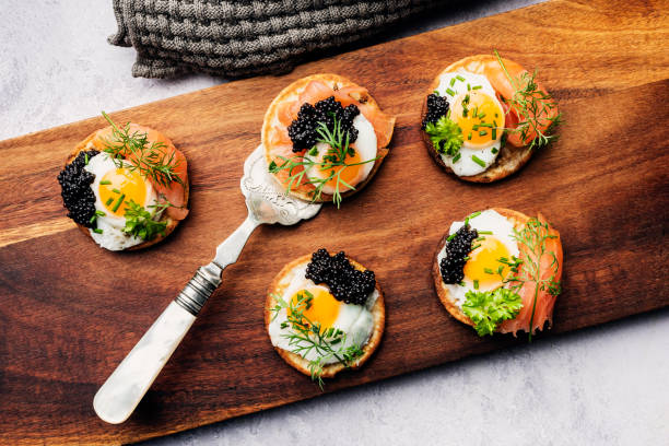 istock Blinis With Quail Eggs Smoked Salmon and Caviar 2197423150