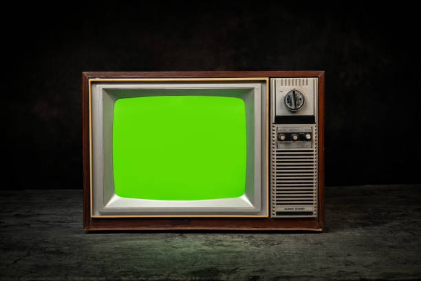 istock Retro old television (TV) with chroma key green screen for designer on the black background with clipping path 2197423880
