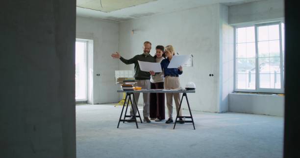 istock The designer discusses the project with the customers 2197424040