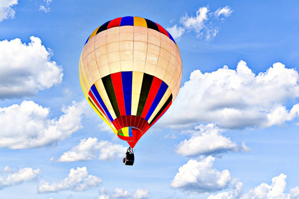 istock Hot air balloon flight over blue sky 2197427550