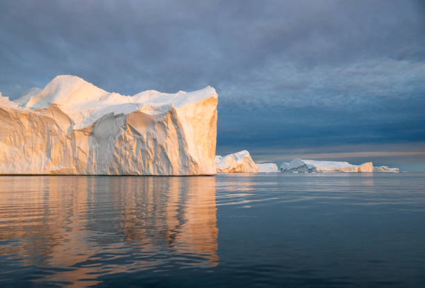 istock Landscape with beautiful pink icebergs hit by the setting sun in Disko Bay in Ilulissat, Greenland 2197430607