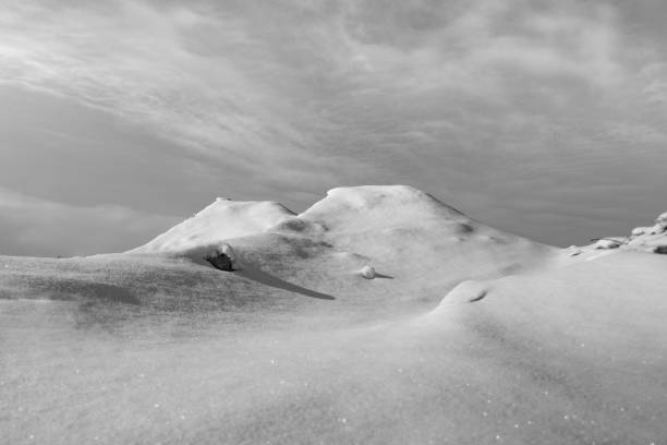 An elevated shot of a snowdrift looks a lot like a snowy mountain