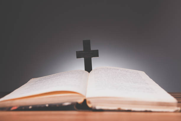 istock bible book on wooden table in the background 2197430639