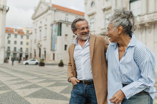 istock Couple sharing a laugh near beautiful architecture 2197432070