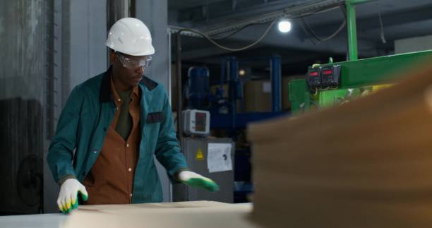 istock Men work in a cardboard factory 2197432104