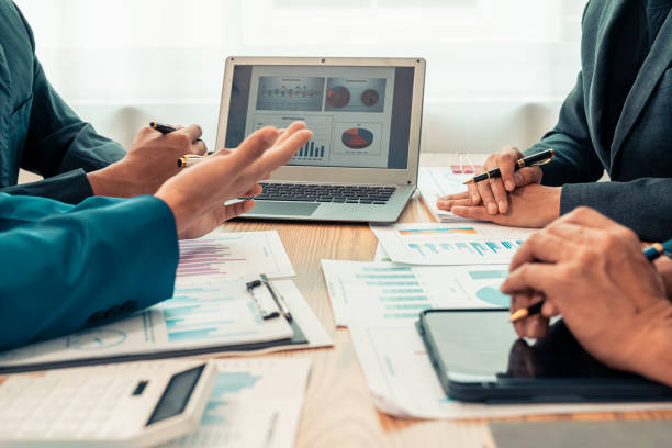 istock Businessman's hands and documents for a meeting budget planning and network strategy, business people, financial and technology documents at the table for creative research analysis 2197435918