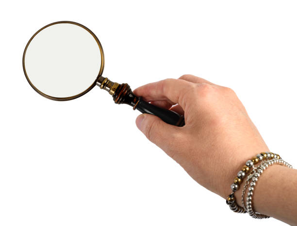 istock Hand with Vintage magnifying glass 2197438417