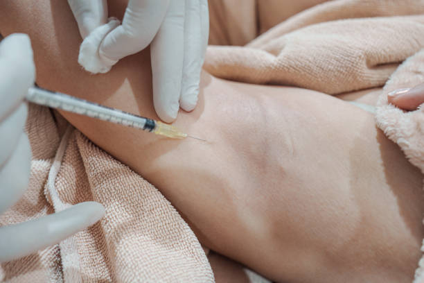 istock Medical specialist injecting syringe bacterial toxin botulin into armpit for reduce body odor and wrinkles 2197438982