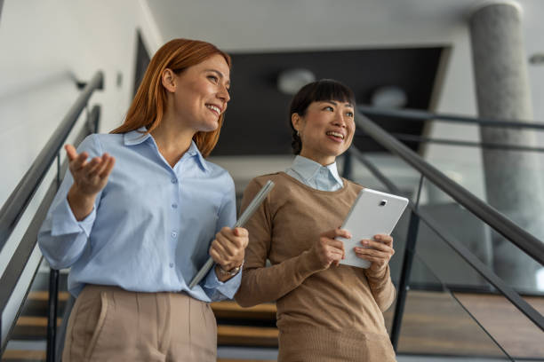 istock Two multiracial businesswomen on the move 2197439627