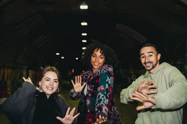 istock Young friends dancing and having fun together at night 2197440457