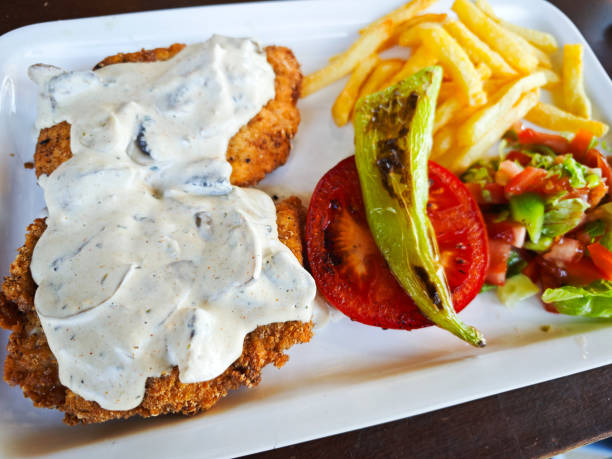 tasty rosted chicken with sosse,chips and salat