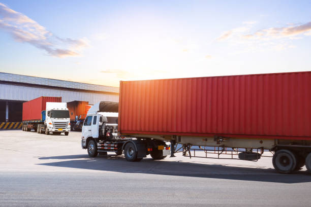 istock Semi Trailer Trucks on The Parking Lot at Warehouse. Trucks Loading Goods at Dock Warehouse. Distribution Warehouse Center. Shipping Containers. Freight Truck Logistics, Cargo Transportation. 2197441213