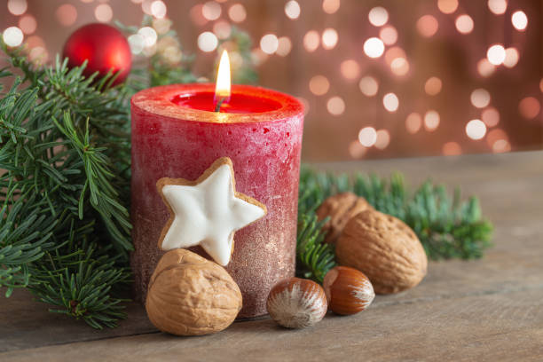 istock Christmas decoration with candle, nuts and lights 2197444409