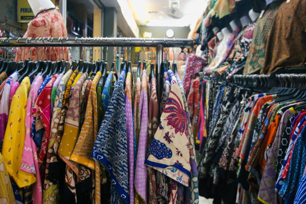 istock Colorful Traditional Patterned Batik Shirts Arranged on Clothing Racks for Display at Beringharjo Market 2197446427