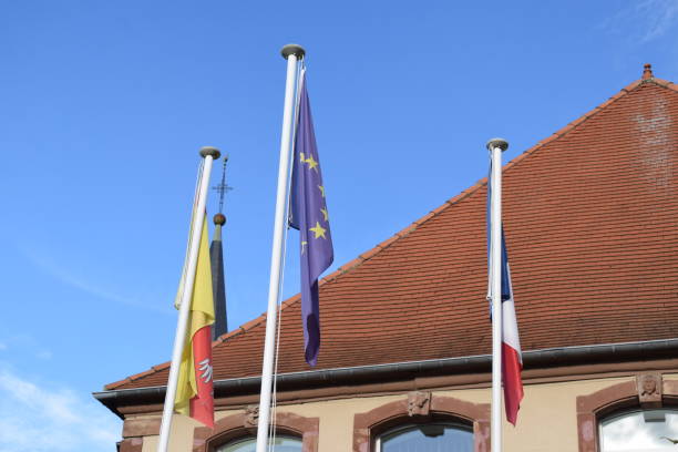 istock flags hanging down, French, EU and Lorraine region 2197446460