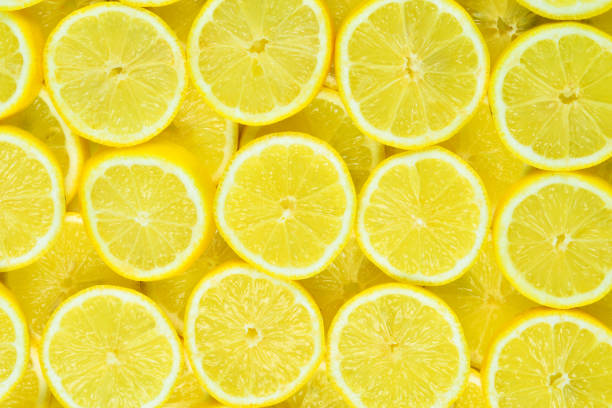 istock A slices of fresh juicy yellow lemons.  Texture background, pattern. 2197446994