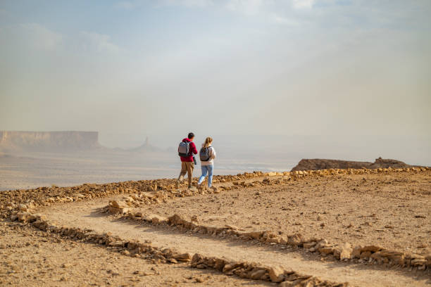 istock Active young couple visiting Edge of the World, Saudi Arabia 2197447623