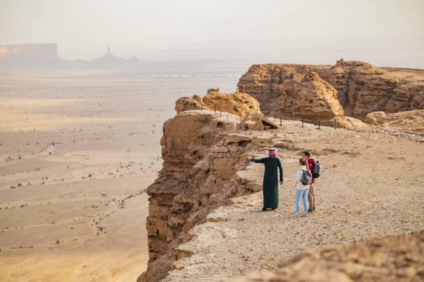istock Local guide introducing tourists to Edge of the World 2197447652