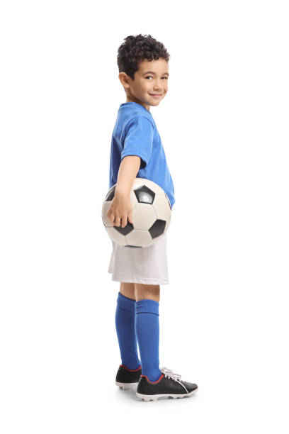 istock Cute little boy football player 2197450112